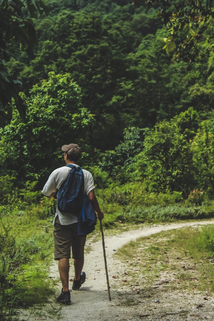 Man Walking on Trail.