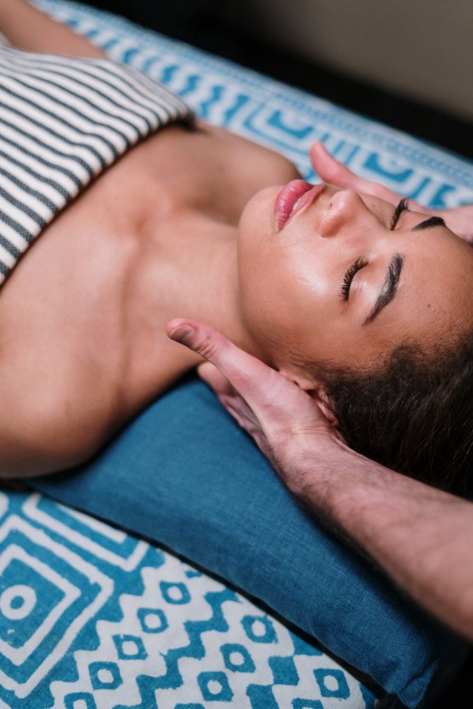 Woman Lying on a massage table.