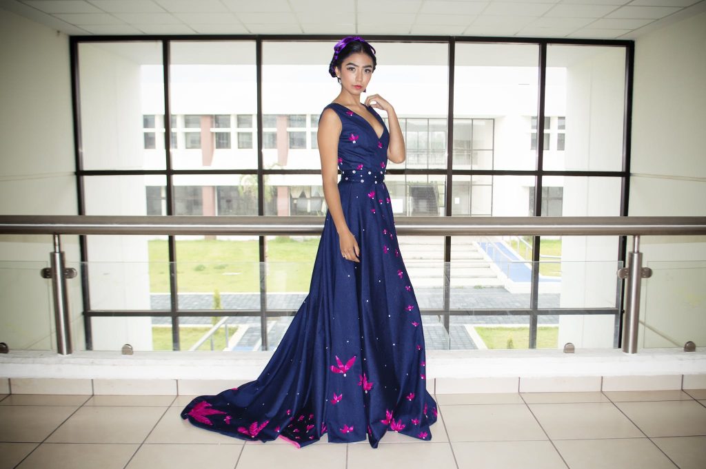 Woman Wearing Blue Floor Length Gown.