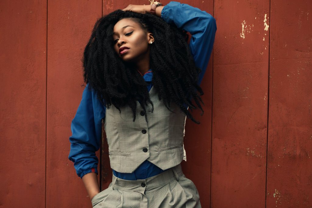 Woman Wearing Gray Waist Coat and Blue Long-sleeved Shirt.