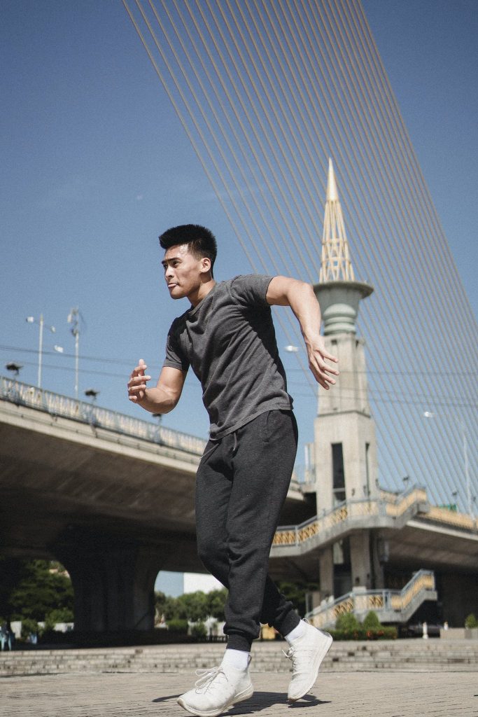 Young Asian male performing street dance.